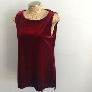 Red velour long sleeveless top.  Longer in the back.